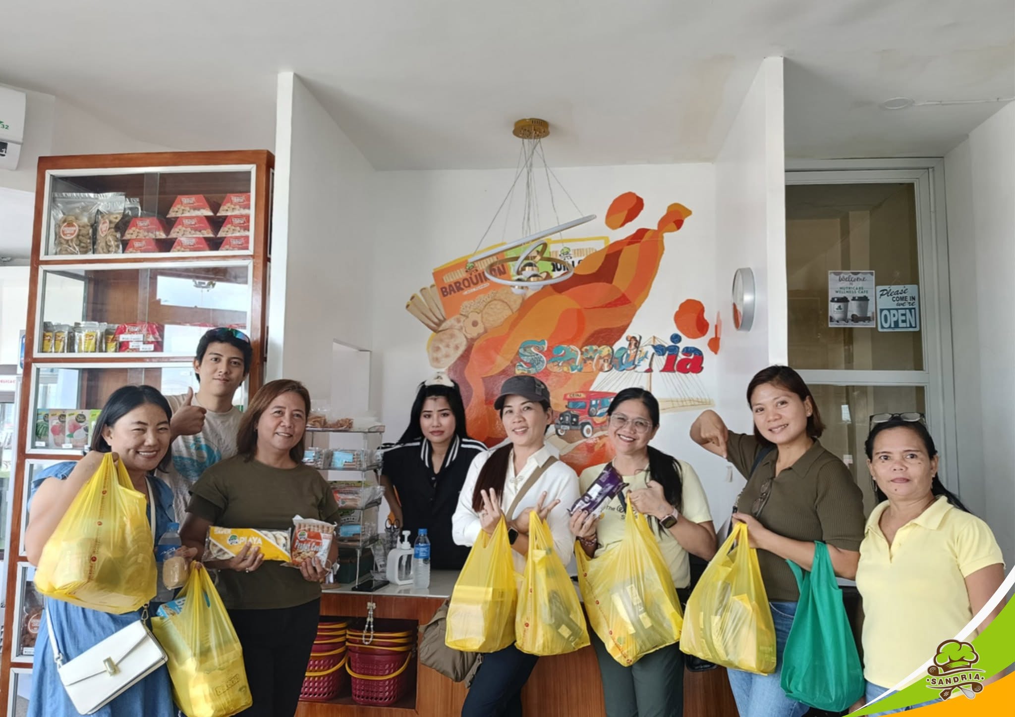 Customers with their Sandria pasalubong hauls